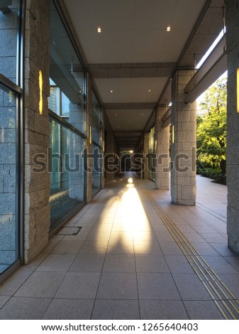 The morning sun light and shadow on the corridor floor on one day of December at Roppongi in Minato, Tokyo, Japan.