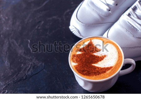cup of cappuccino coffee with Christmas tree symbol pattern on milk froth