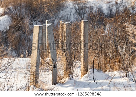 concrete old pillar in the snow