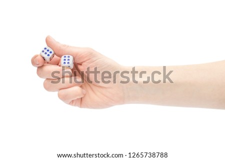 Woman's hand holding playing dices. Isolated on white.