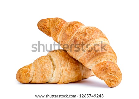 Delicious, fresh croissants on a white background. Croissants isolated. French breakfast Royalty-Free Stock Photo #1265749243