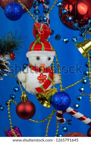 beautiful new year and christmas toys, ball, snowmen on blue background
