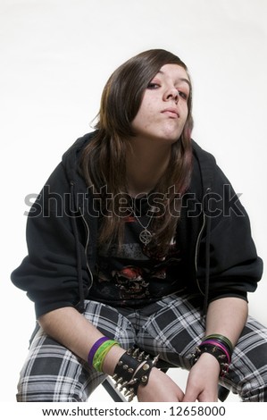 Punk emo teenage girl with attitude on white background