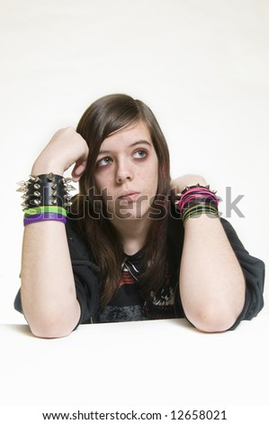 Punk emo teenage girl with attitude on white background