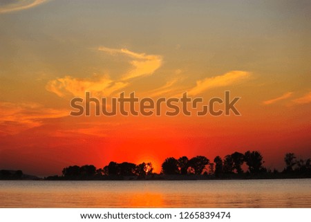 Sunset on the lake. water and beautiful colored sky