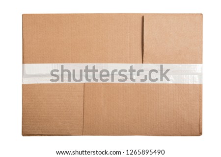 Top view of rectangular cardboard box with a sticky tape isolated on white background Royalty-Free Stock Photo #1265895490