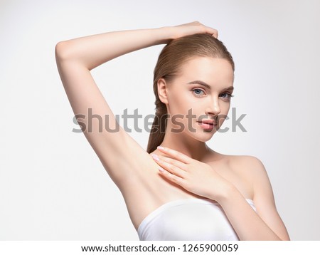 Armpit woman hand up deodorant care depilation concept Royalty-Free Stock Photo #1265900059