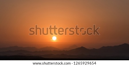Sunrise frame and the layers of mountain from Arabian desert of Saudi Arabia.