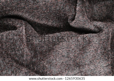 Texture of brown faux fur for clothing.