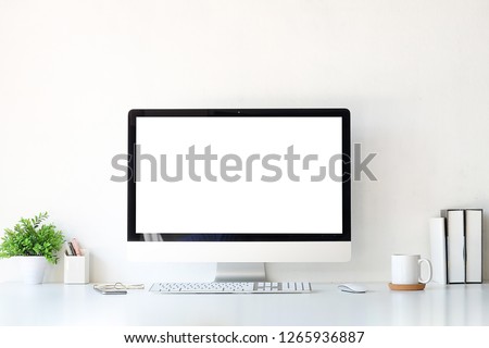 Office desk Workspace stuff with notepad, laptop and coffee cup mouse notepad shot.  Royalty-Free Stock Photo #1265936887
