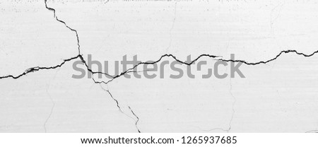 crack white wall texture Royalty-Free Stock Photo #1265937685