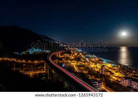 Night view of city buildings with highway traffic light