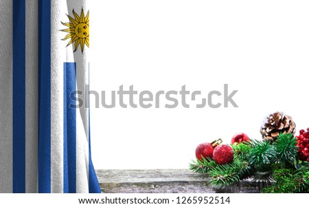 Christmas and new Year background with a flag of Uruguay. There is a place for your text in the photo