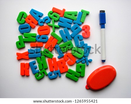 multicolored letters on white background