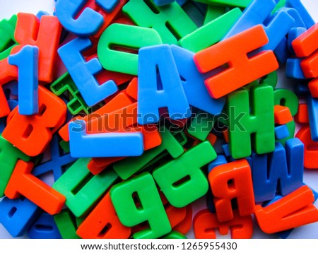 multicolored letters on white background