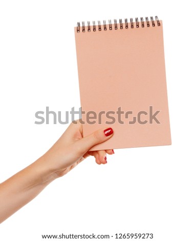 Notebook  in hand. Isolated on white background.