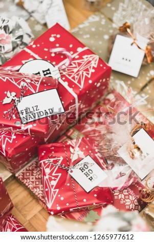 Big and small red and golden gift boxes, the Christmas toys isolated