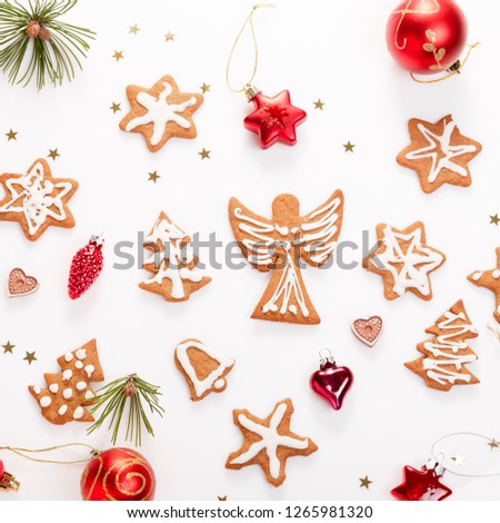 Christmas homemade gingerbread cookies and christmas tree on white table. Christmas banner. Top view, flat lay, copy space. Scandinavian handmade style