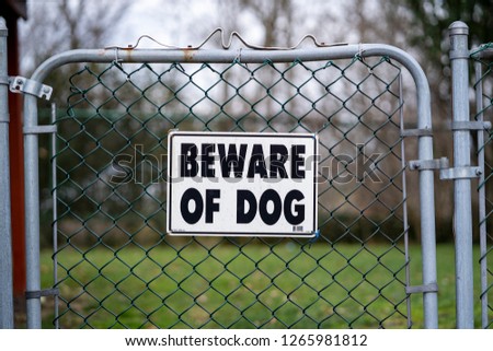 Beware of Dog Sign on Back Yard Fence Royalty-Free Stock Photo #1265981812