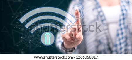 Woman touching a wifi security concept on a touch screen with her finger