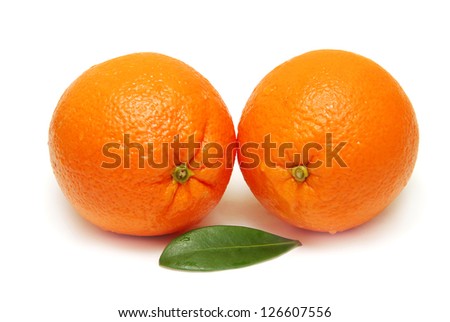 Sweet orange fruit with leaves on white background