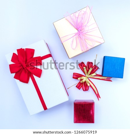 Top view of gift box and ribbon on white background.