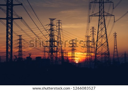 Electricity distribution station. high voltage electric transmission tower. high-voltage power lines at sunset. Silhouette image. High voltage tower and Colorful sky. transmission towers