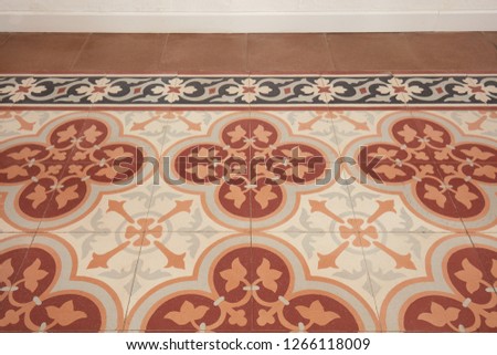 Decorated tiled floor, liberty style in an ancient apartment in Italy