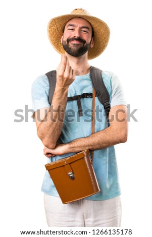 Funny tourist making money gesture on isolated white background