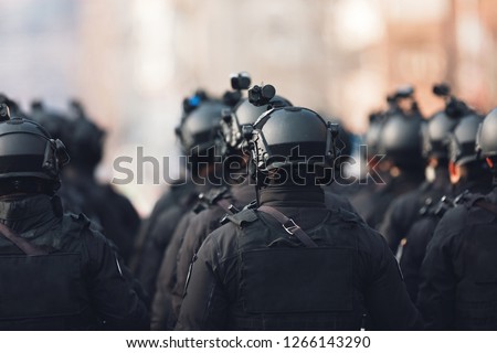 anti terrorism squad with military equipment with special tactical force counter terrorism assault technology Royalty-Free Stock Photo #1266143290