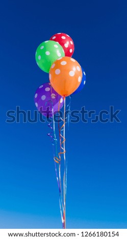 balloons against the blue sky