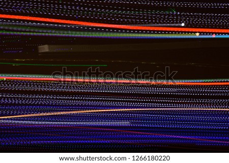 Abstract multi color line background against black background