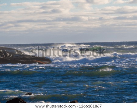 Winter Waves at Peggy's Cove during sunset.