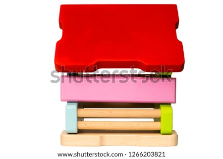 Wooden toy house, on white background.Build a small house.