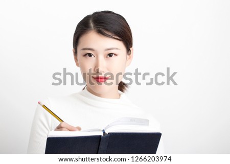 Girl taking notes