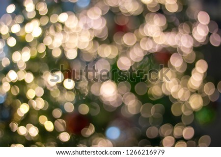 Golden light blurry bokeh background.Glitter and glow circle pattern.Celebration of christmas and happy new year festive illuminated.Blurred backgroung.Art of light