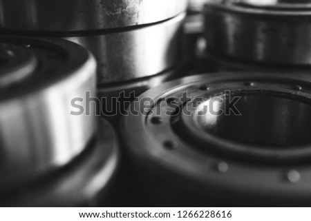 Machinery concept. Set of various gears and ball bearings old and new, BW, black and white