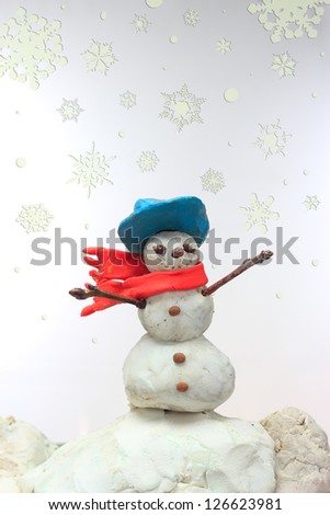 snowman made in plasticine in winter scene