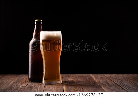 Photo of buttle and glass of beer