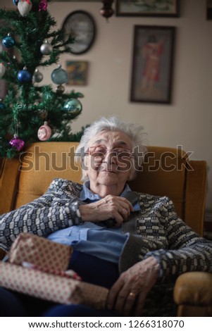 Old woman waiting for call.