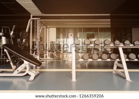Sport room with dumbbells and fitness equipment
