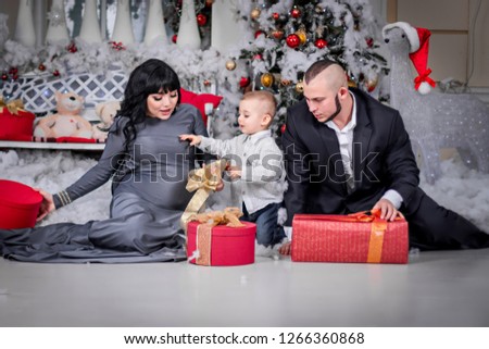 Happy family of Christmas open gift.
