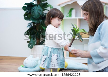 Mother and child playing in the room