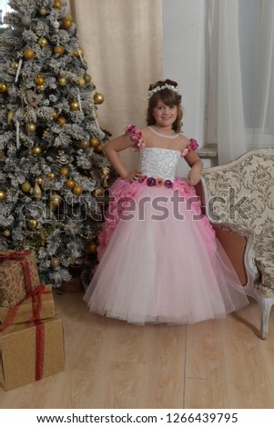 Young princess in white with pink elegant dress