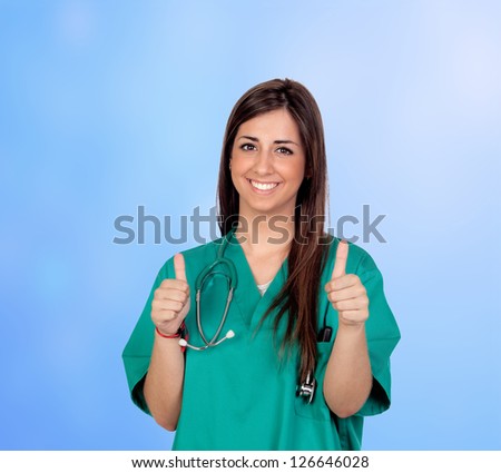 Attractive medical saying ok girl isolated on blue background