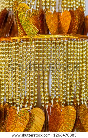 Pattrened of golden paper Bodhi leaf and hanging bead, paper Bodhi leaf and hanging bead is popular decoration in Budha temple in Thailand