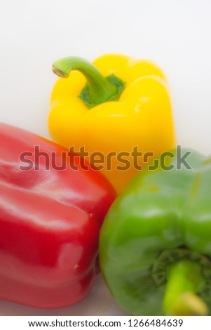 Yellow and red and green bell peppers, isolated on white background, top view, flat laying - pictures