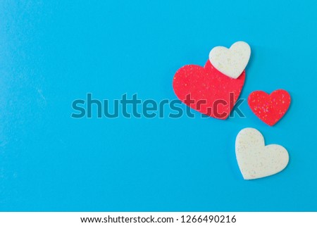 The  heart on blue background close up image.