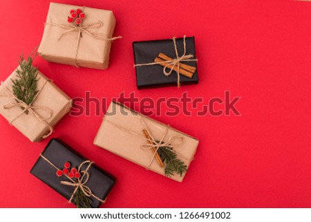 Christmas composition. Gifts, fir tree branches, red decorations on white background. Christmas, winter, new year concept. Flat lay, top view.