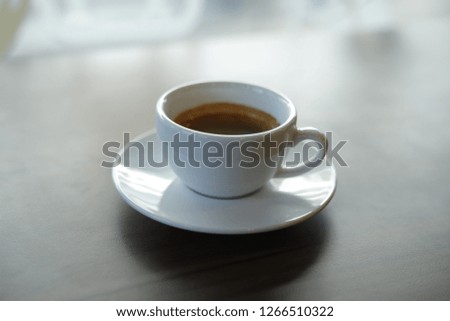 Espresso coffee  in wooden, black background.
